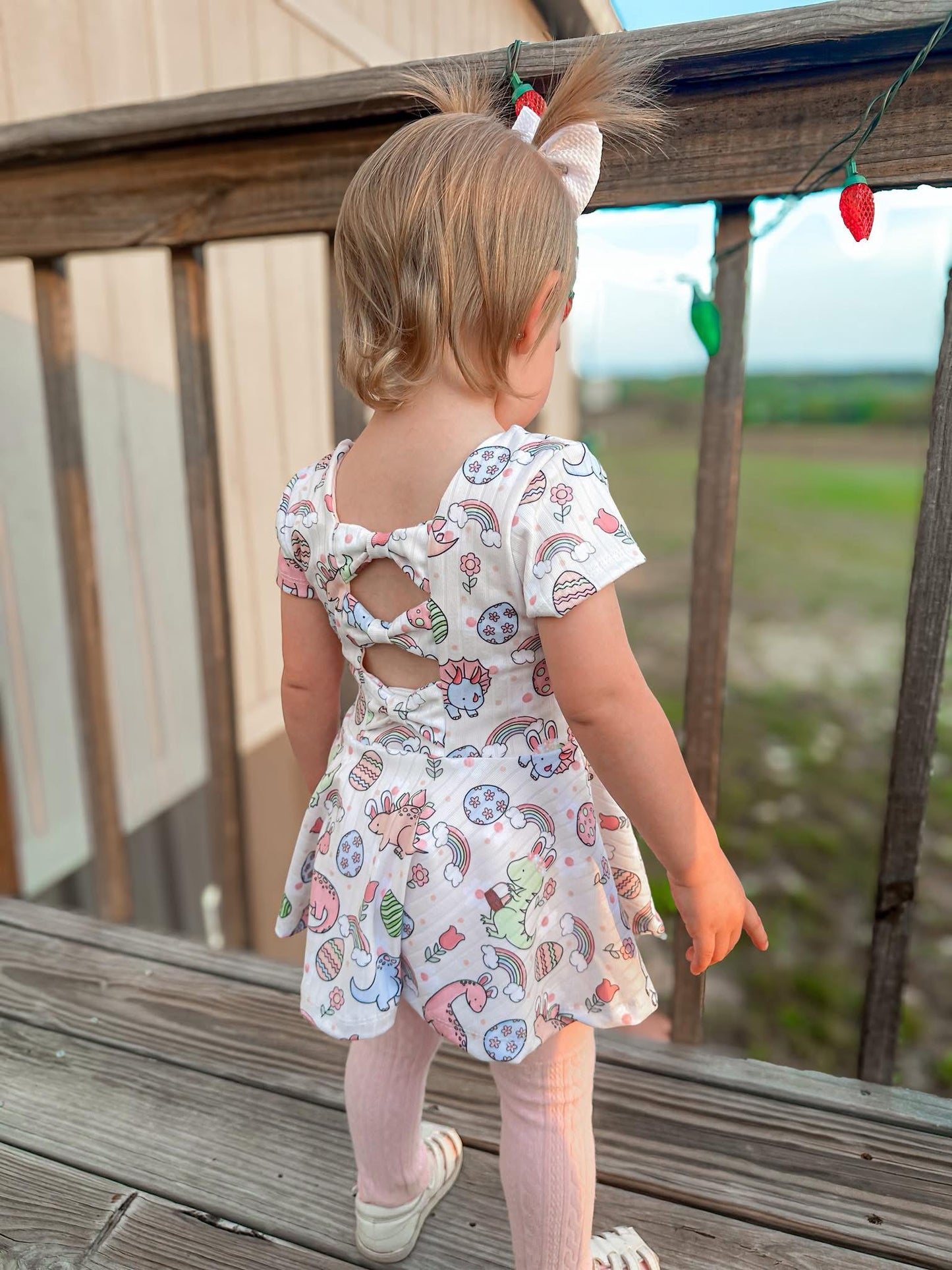 ARIA BOW BACK PEPLUM